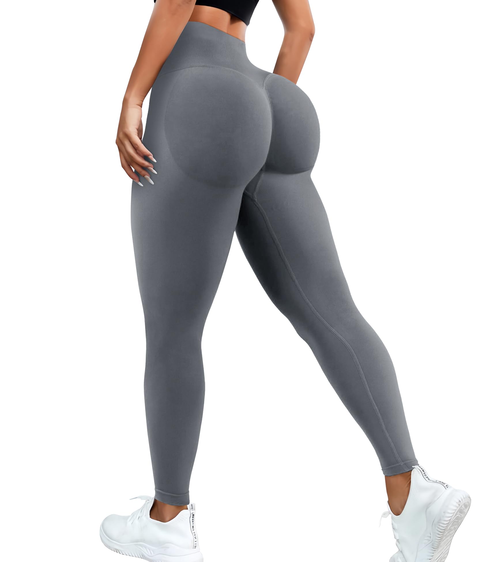 Gray leggings worn by a person on a white background