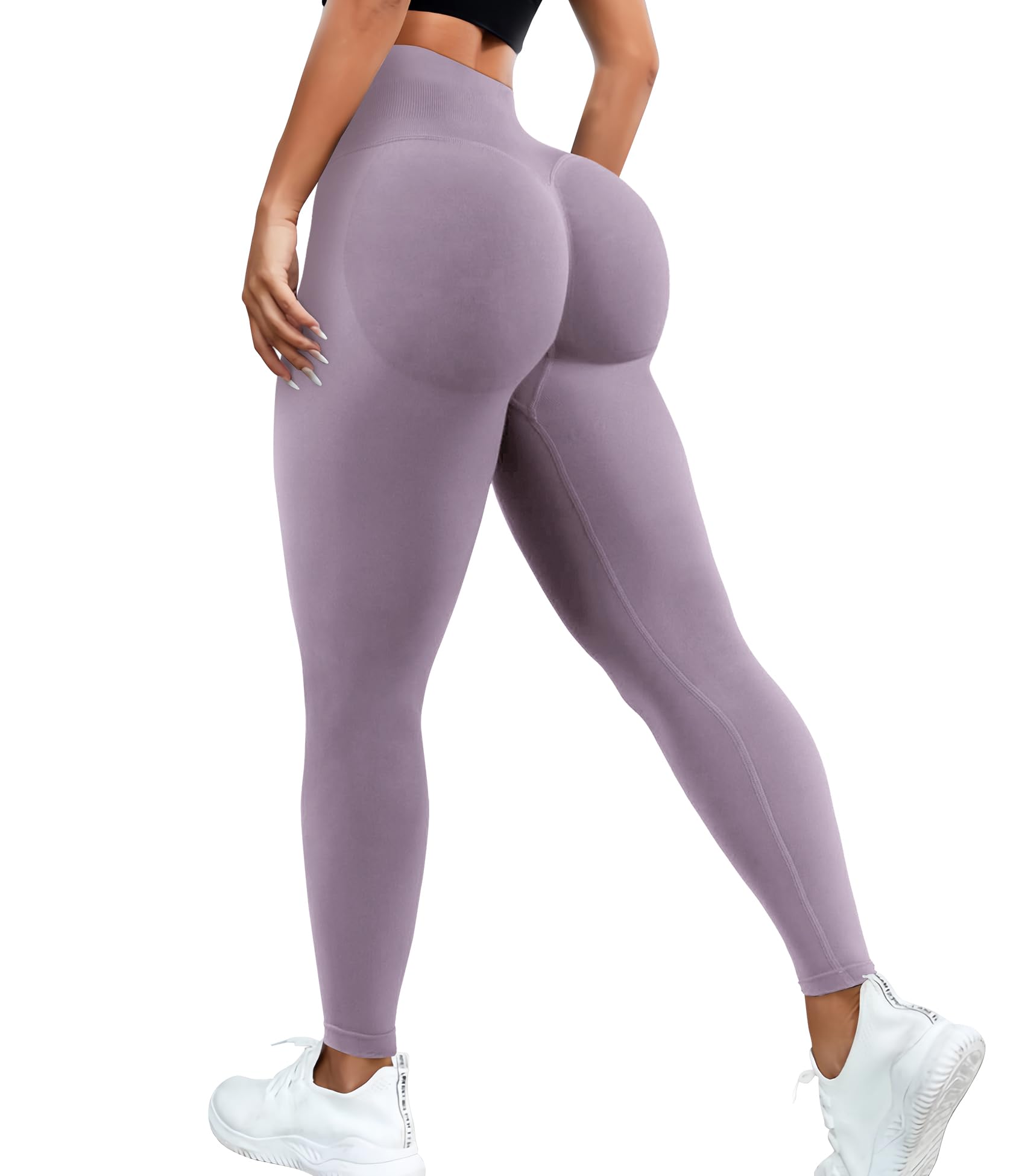 Purple leggings worn by a person on a white background