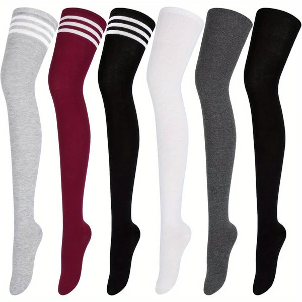 Set of six pairs of knee-high socks in various colors on a white background